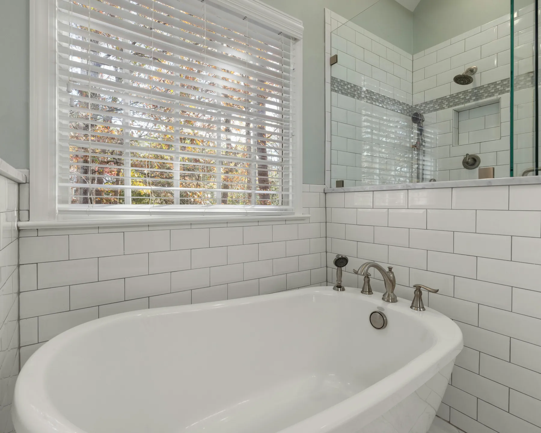 Placeholder image of a bathroom with a soaking tub and glass shower.